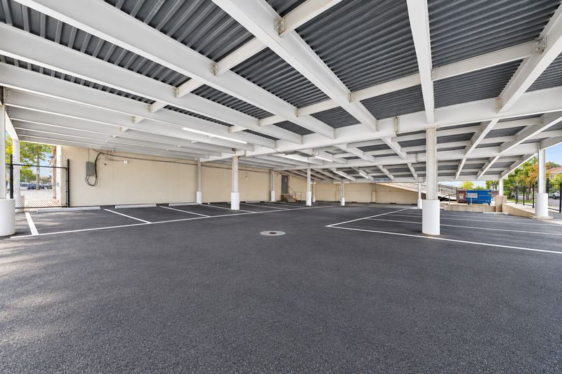 Covered parking lot next to the building